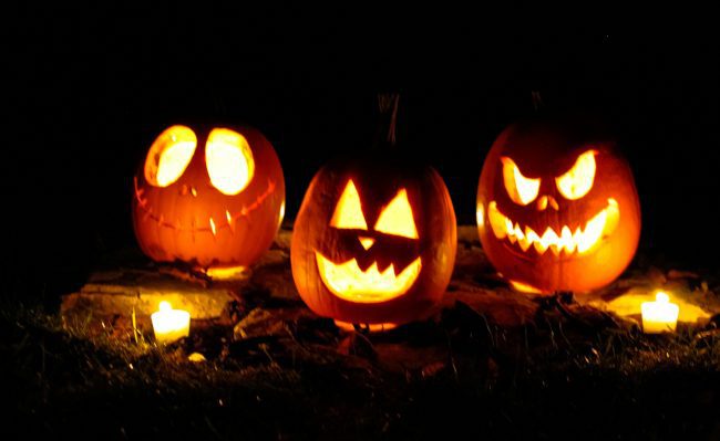 Carved pumpkins lit up with tea lights.